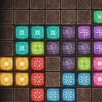 Farklı renklerde geometrik desenlerin yer aldığı kare bloklarla dolu bir ızgara