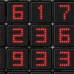 Kırmızı ledli sayılarla dolu siyah kare düğmelerden oluşan dijital bir ekran