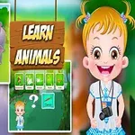 Bir kız çocuğu ve safari aracındaki hayvanlar ile Learn Animals (Hayvanları Öğren) yazılı tabela