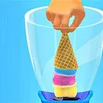 Bir el, dondurma külahını mavi bir blenderın içine yerleştiriyor