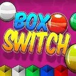 Renkli toplar, Box Switch yazısı ve çeşitli renkte kutular pembe bir arka plan üzerinde yer alıyor