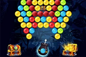 Renkli toplarla dolu bir ekranın ortasında bir mancınık ve alt kısımda hazine sandıkları