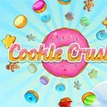 Renkli şekerler ve kurabiyelerle çevrili pembe bir çörek önünde Cookie Crush 2 yazısı