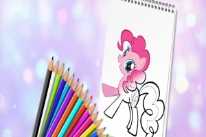 Renkli kalemlerin yanına konmuş, beyaz bir defterde pembe ve beyaz bir pony çizimi