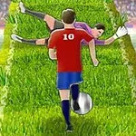 Kırmızı forma giymiş bir futbolcu, yeşil bir yol üzerinde top sürerken, kaleci yere uzanmış durumda