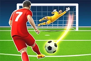Kırmızı forma giymiş bir futbolcu, topa vurarak kaleye şut çekerken, sarı kıyafetli kaleci topu kurtarmaya çalışıyor