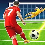 Kırmızı forma giymiş bir futbolcu, topa vurarak kaleye şut çekerken, sarı kıyafetli kaleci topu kurtarmaya çalışıyor