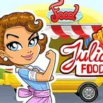 Bir kadın karakter, yanındaki renkli gıda kamyonunun önünde belirgin bir şekilde gösteriliyor ve yanında Julias Food Truck yazısı bulunuyor