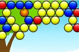 Renkli toplar mavi gökyüzü ve ağaç arka planı ile üst üste dizilmiş