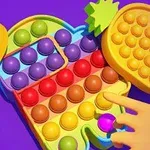 Renkli bir pop-it oyuncağı ve üzerinde bir el