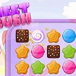 Pastel renkli şekerler ve çikolataların yer aldığı bir eşleştirme oyunu ekranı