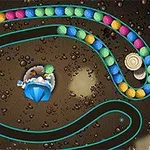 Renkli topların spiral bir yolda ilerlediği, ortada mavi bir yapının bulunduğu görsel