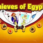 Thieves of Egypt yazısıyla beraber kart destesi ve etrafta altın madeni paralar