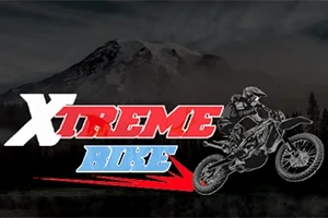 Arka plandaki dağ manzarası önünde, Xtreme Bike yazısı ve bir motosiklet sürücüsünün illüstrasyonu